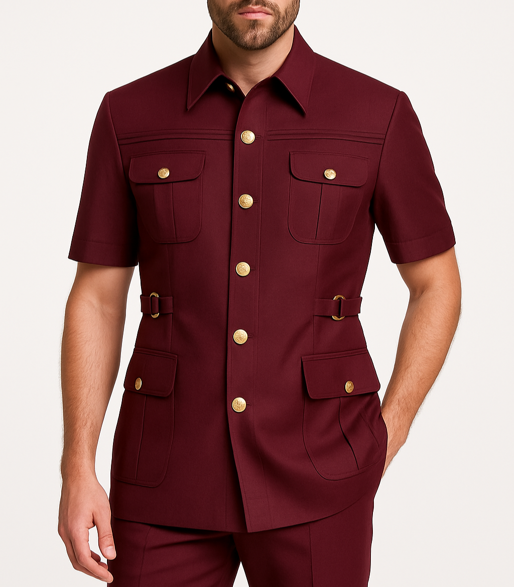 Man wearing a maroon short-sleeve shirt with gold buttons on a white background