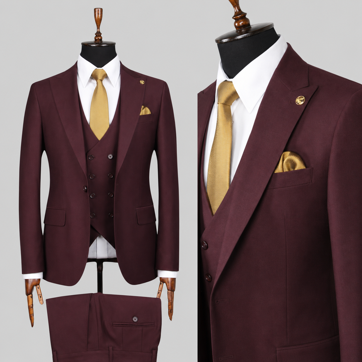 A men's three-piece suit displayed on mannequins against a light gray background. The suit is a deep burgundy/maroon color, paired with a white dress shirt, a gold tie, and a matching gold pocket square.